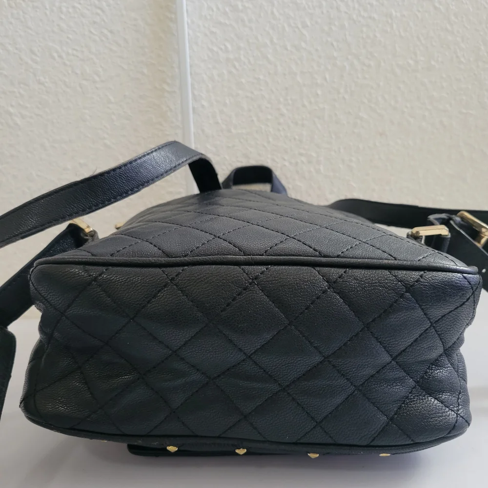 Michael Kors Black Quilted BackpackMichael Kors Black and Gold Quilted Backpack.